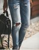 Women's Light Wash Stretch Ripped Mid-High Waist Jeans with 4-Button Design