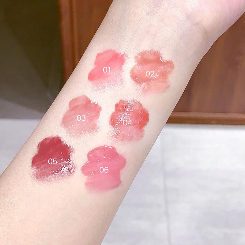 OUOII Luminous Butterfly Wing Lip Tint: Glossy, Plump, Long-Lasting, and Moisturizing Lip Gloss with Subtle Color.