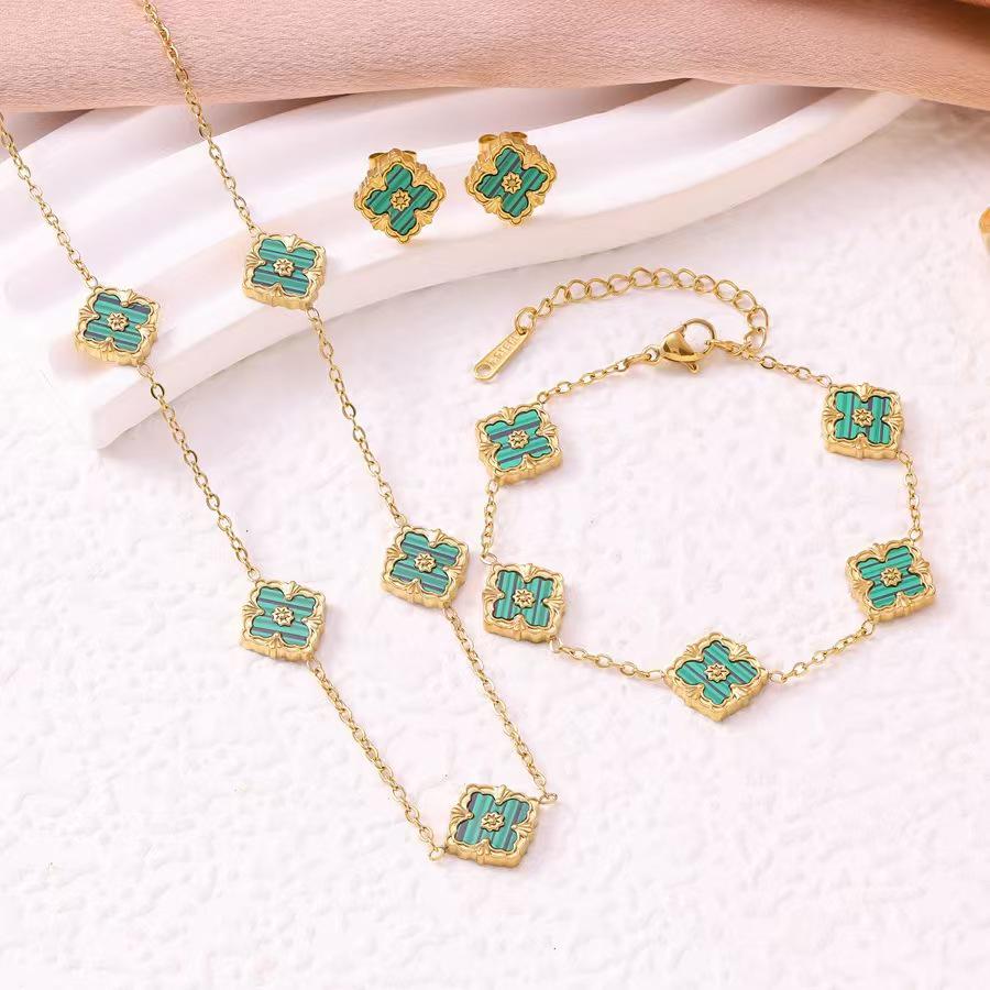 European Three-Piece Jewelry Set: Retro Black Gold Four-Leaf Clover Necklace, Earrings, and Bracelet