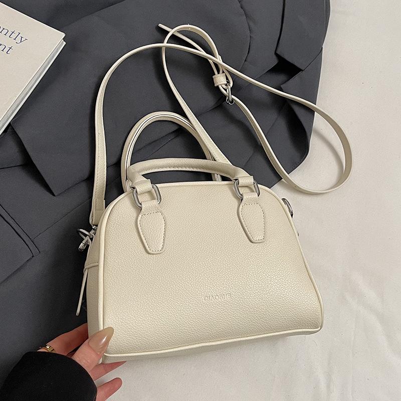Spring Korean Version of Simple Fashion Texture Portable Bowling Women's Bag Casual Versatile Foreign Style Niche Design Messenger Bag