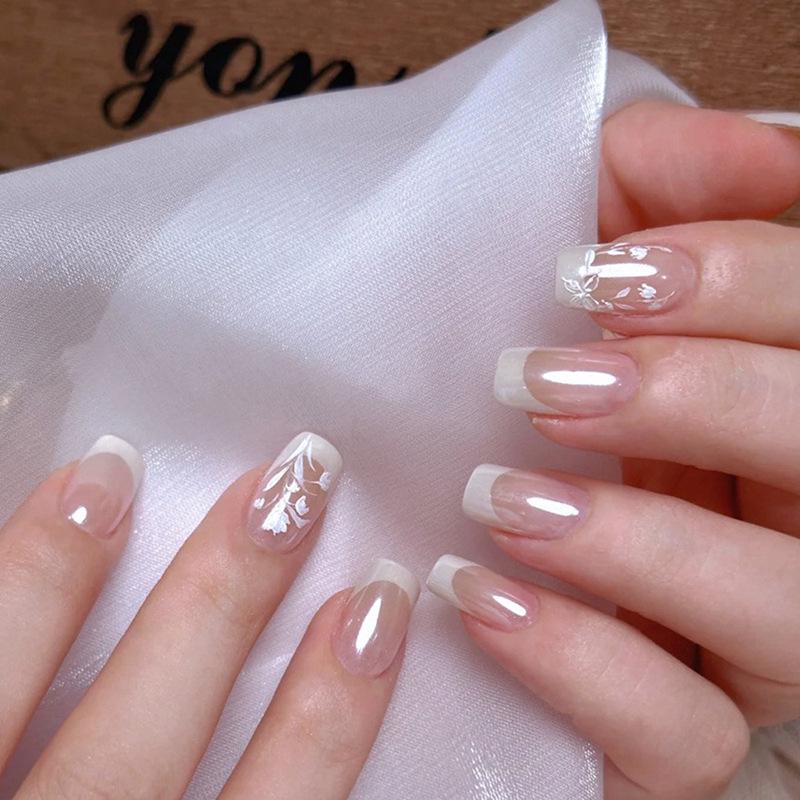 

Translucent Pearlescent Crescent White Press-On Nails with Flower Embellishments