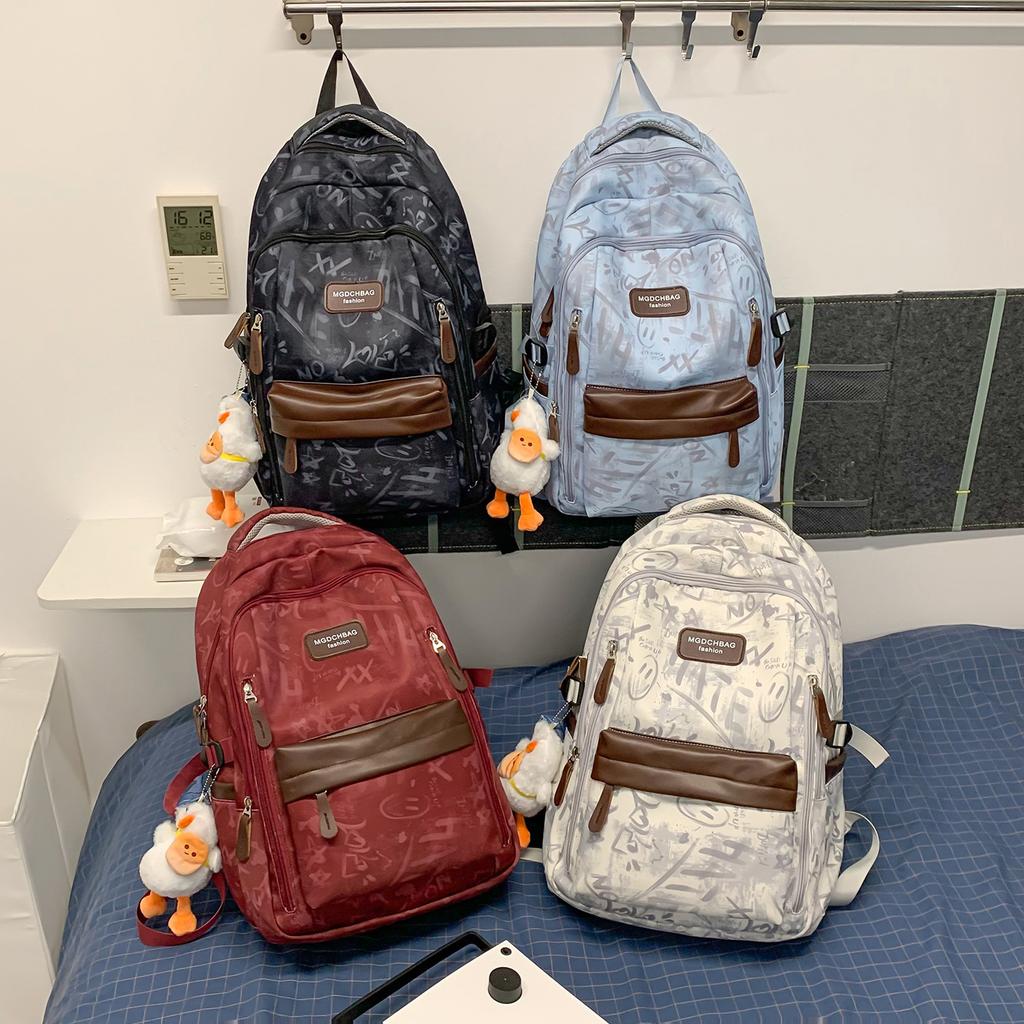 Schoolbag new graffiti niche schoolbag male junior high school student high school student lightweight backpack college student large capacity
