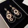Silver needle European and American knotted round pleated metal fringed pendant earrings versatile stud earrings niche design earrings women