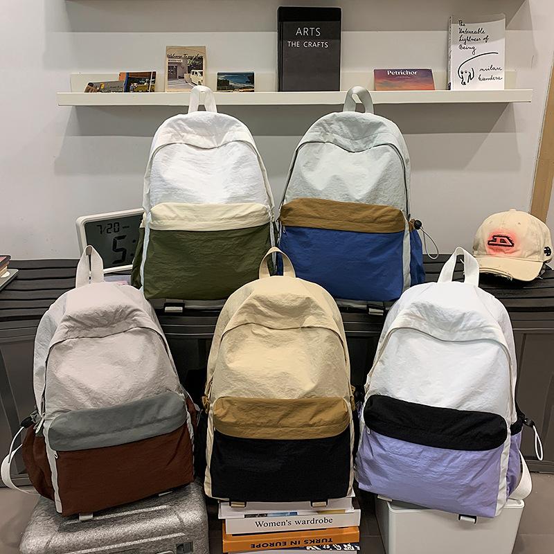 Schoolbag Lightweight color matching sports wind backpack Simple solid color Large capacity mountaineering travel backpack Casual college student