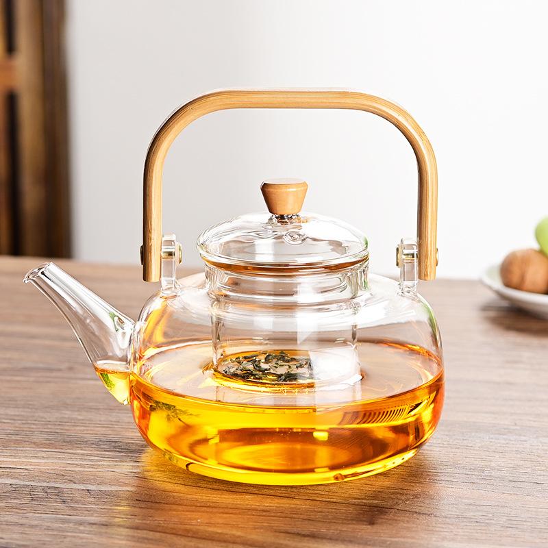 Tea Pot with Bamboo and Wood Handles Made of Borosilicate Glass Tea Cups Set and Capable of Open Flame Tea and Water Separation