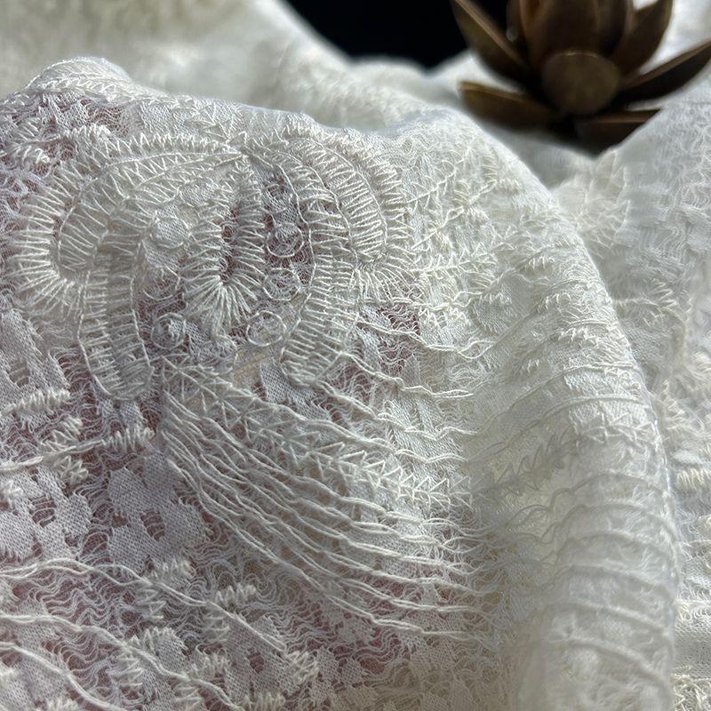 Retro patterned tattoo fabric with base of floral design suitable for wedding dresses formal gowns and designer clothing fabrics