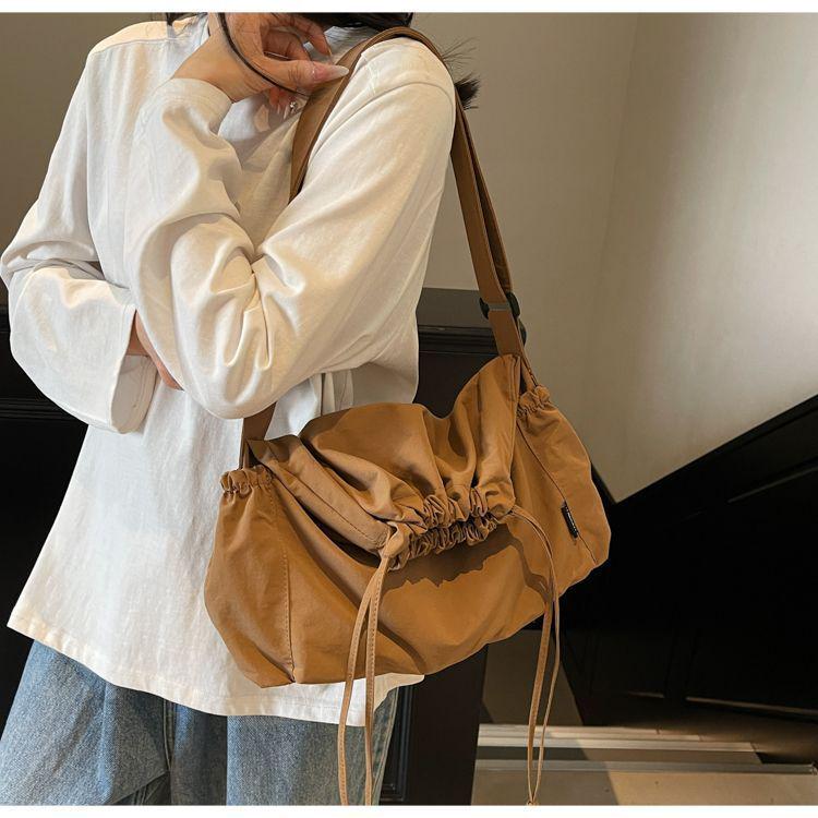2025 Black Pleated Drawstring Tote - Large Capacity, Versatile Single-Shoulder Crossbody Bag for Casual and Commute Use.