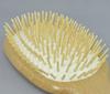 A scalp massage brush that gently stimulates and reduces static electricity, preventing damage to hair.