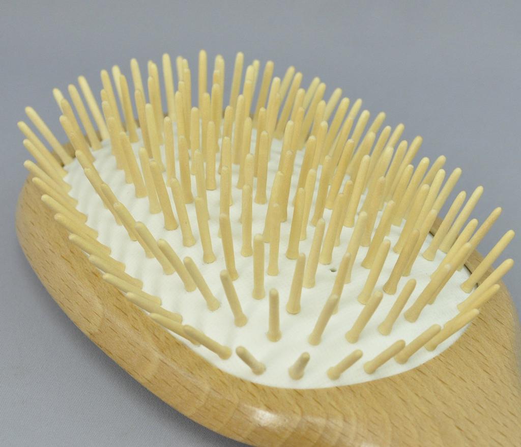 A scalp massage brush that gently stimulates and reduces static electricity, preventing damage to hair.
