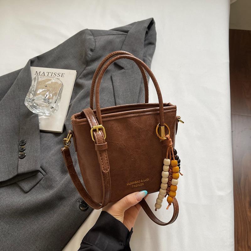 Casual retro small bag women's new fashion messenger bag commuter shoulder high value bucket bag