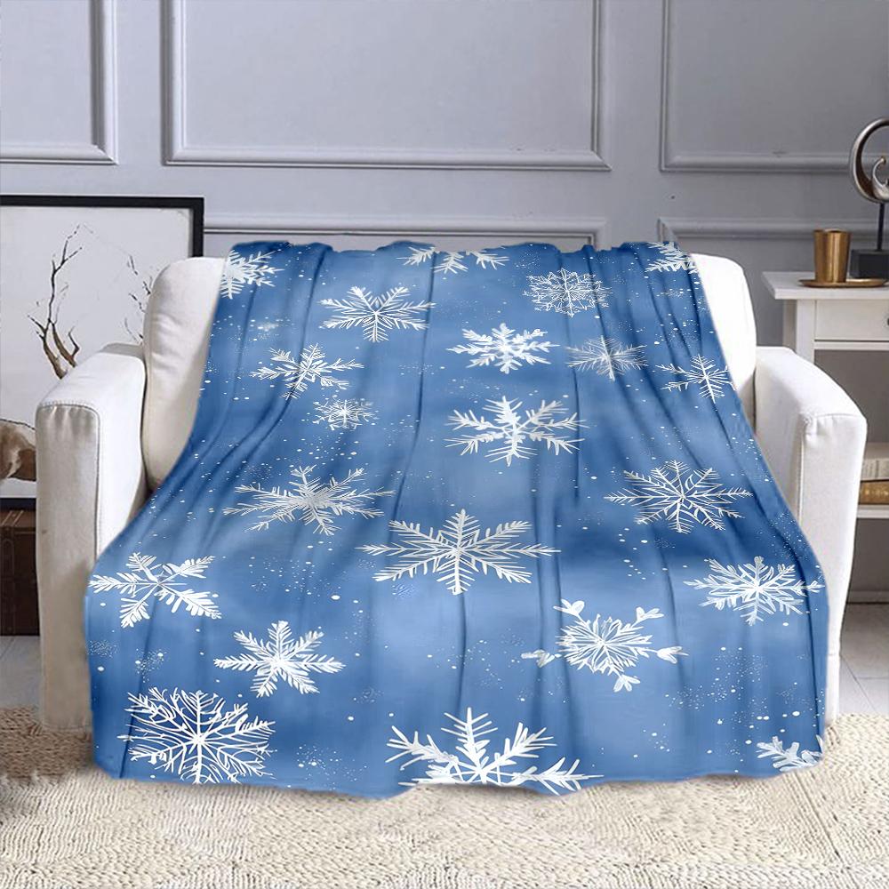 Snowflakes on a Blue Winter Background Patterned flannel blanket perfect for the bedroom living room, sofa, or a little nap
