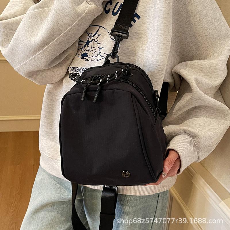 Fashion sense small backpack women's lightweight casual shoulder bag new fashion commuter shell bag simple commuter messenger bag