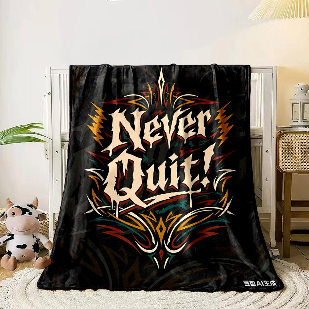

A bold Never Quit! text surrounded by dynamic tribal-style patterns. for all seasons blanket lunch break throw gift 80cm x 120cm