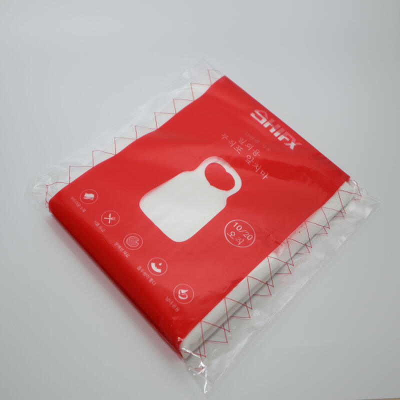 10 disposable non-woven aprons in OPP packaging