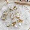 CARLIDANA French Design Stainless Steel Gold Plated U Pearl Bow Flower Earrings for Women's Fashion High Quality Luxury Jewelry