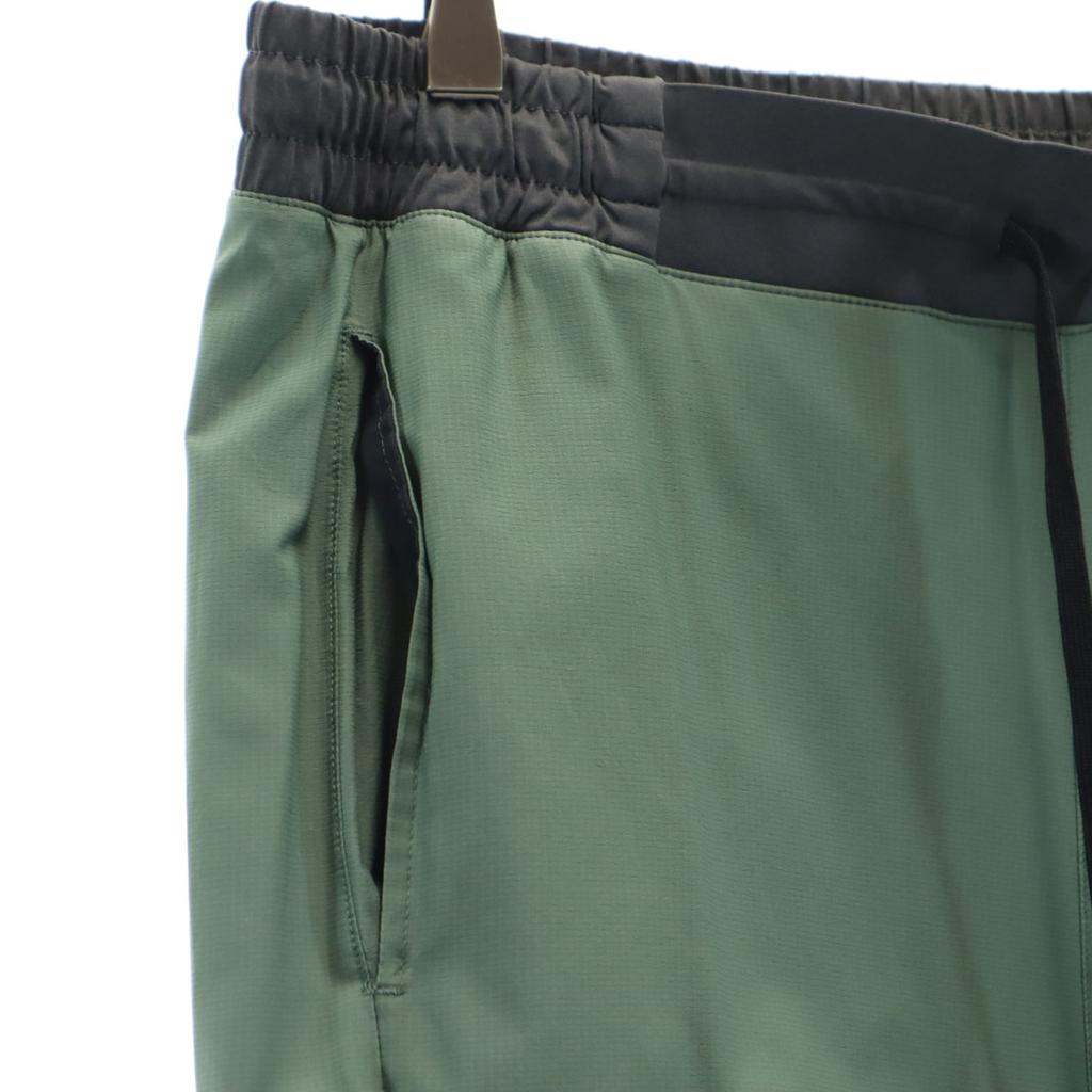 QN běžecké kalhoty L Zelený systém Pánské Použité