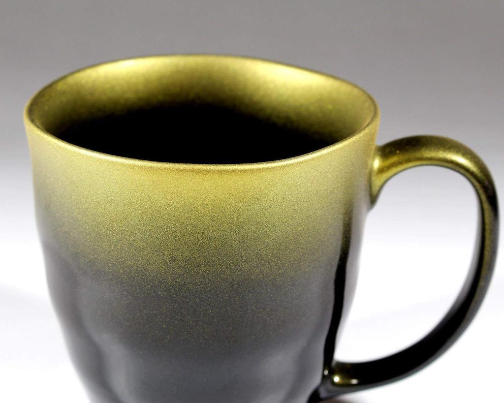 Pair of ceramic mugs in a paulownia box made by an Arita ware potter with great care Tenmoku glaze gold color platinum color Ceramic artist Nishikiya