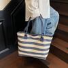 Large capacity fashion straw bag women's stripe contrasting color resort beach bag temperament commuter portable shoulder bag