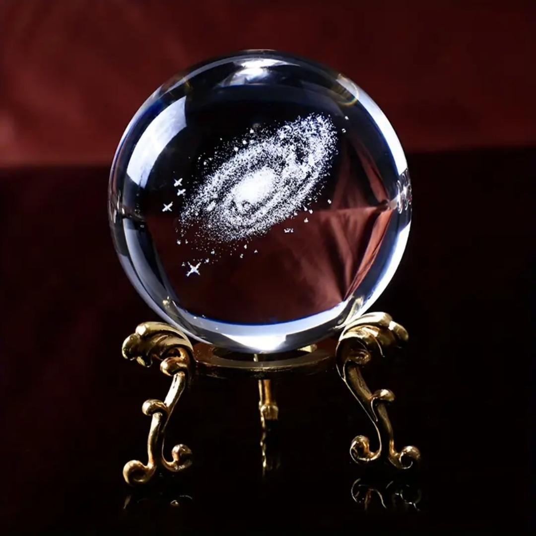 

Handcrafted crystal ball decoration - A glass ball with a golden base depicting the galaxy starry sky. Ideal for Valentine s Day