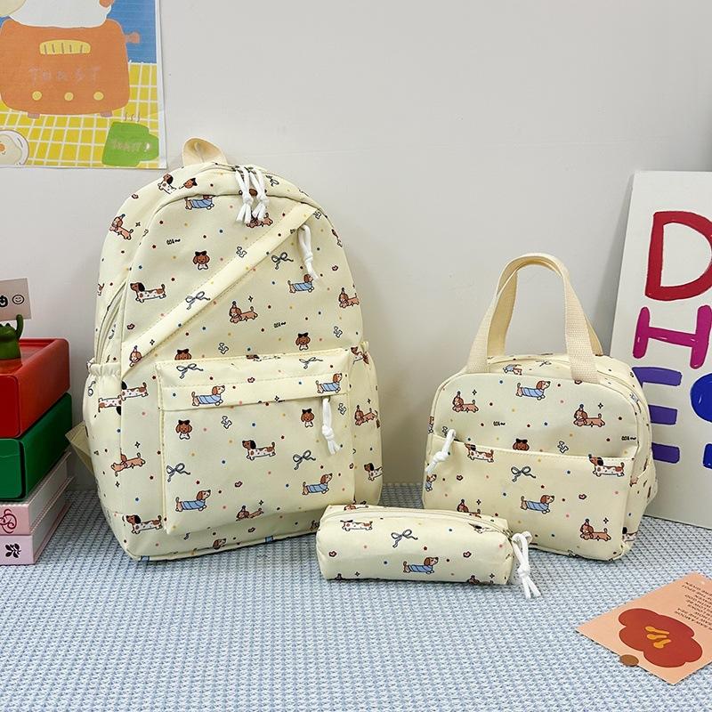 New cartoon printed women's schoolbag, junior high school and primary school students reduce the burden of three-piece backpack, large-capacity