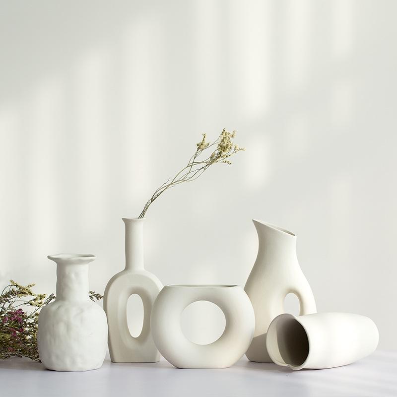 White Ceramic Vase with Dried Baby's Breath for Living Room or Dining Table Decoration