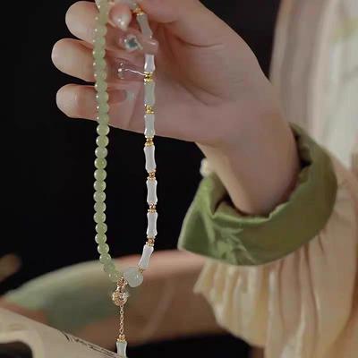 Bracelet en Bambou Jade Soie Dorée: Élégant design de citrouille perlée avec imitation jade Hetian dans un style rétro chinois nouveau