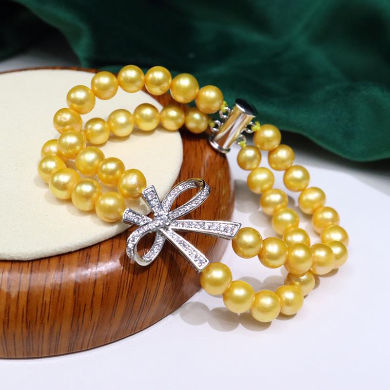 077 Freshwater Pearl Bracelet 7-8mm with Bow Design: Versatile, Elegant, High Luster Jewelry with Minor Flaws