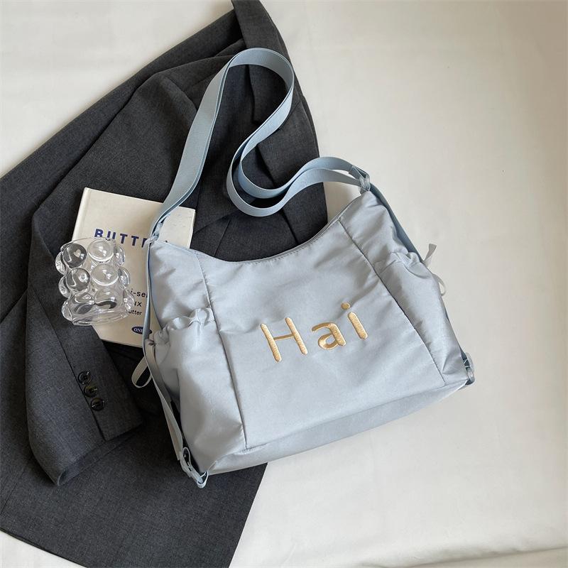 Tote bag women's 2024 new large-capacity commuting letter foreign feeling college students commute to class shoulder backpack