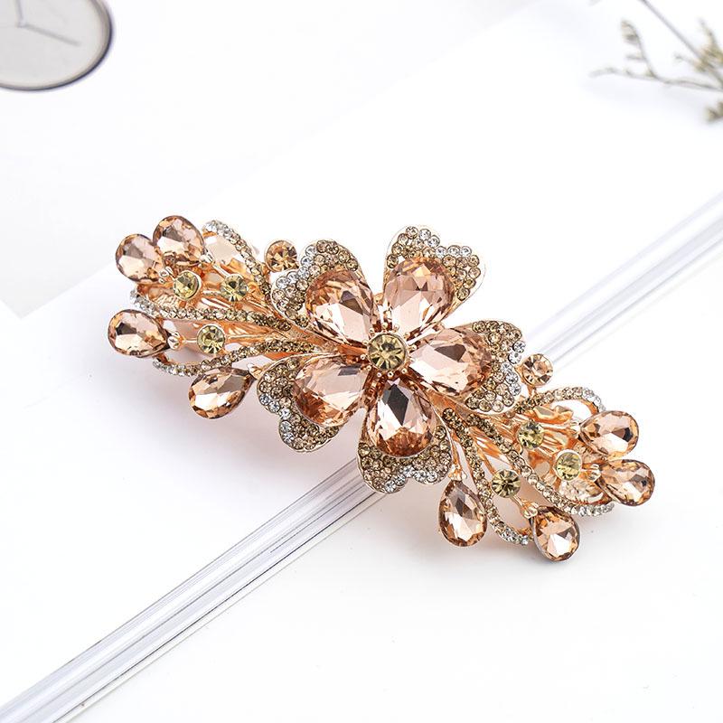 

Корейська шпилька для волосся зі стразами з квіткою та весною