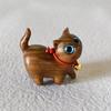 Adorable Green and Black Sandalwood Cat Ornament - Cute, Curious Desktop Miniature, Perfect Creative Gift for Kids.