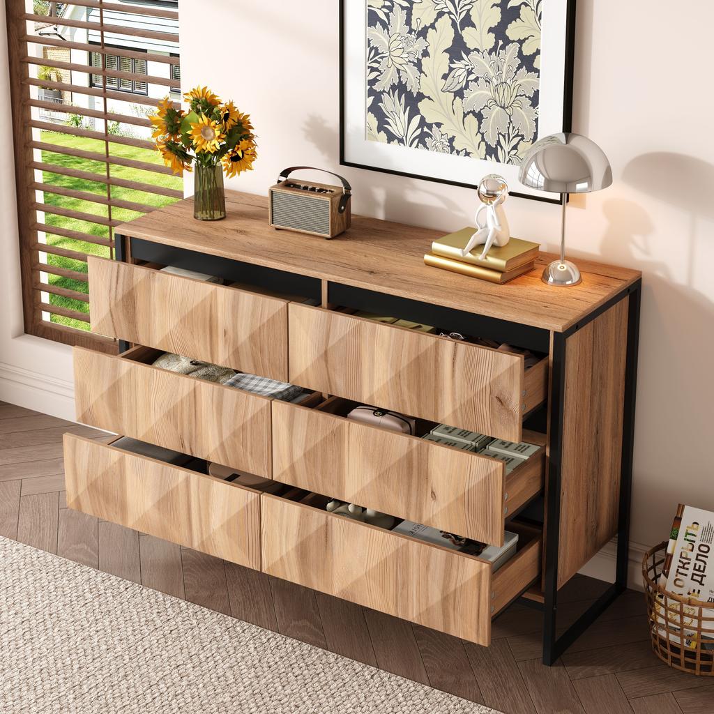 The sideboard and the chest of drawers are characterized by a combination of black and natural wood tones, metal legs and raised doors.