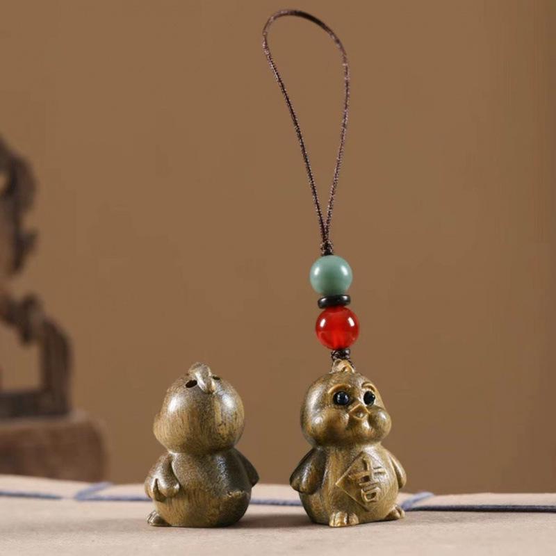 Twelve Zodiac Animal Charms Green Sandalwood Set: Rat, Ox, Tiger, Rabbit, Dragon, Snake, Horse, Sheep, Monkey, Rooster, Dog, Pig.