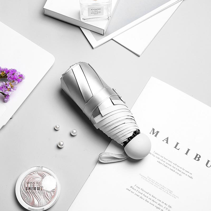 Titanium silver glue 50% off sun umbrella women's sunscreen parasol small fresh weather and rain folding umbrella umbrella