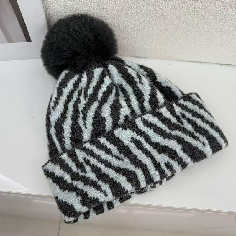 Zebra pattern hairball knitted hat women's autumn and winter retro versatile face small wool hat cold-proof warm ear hat