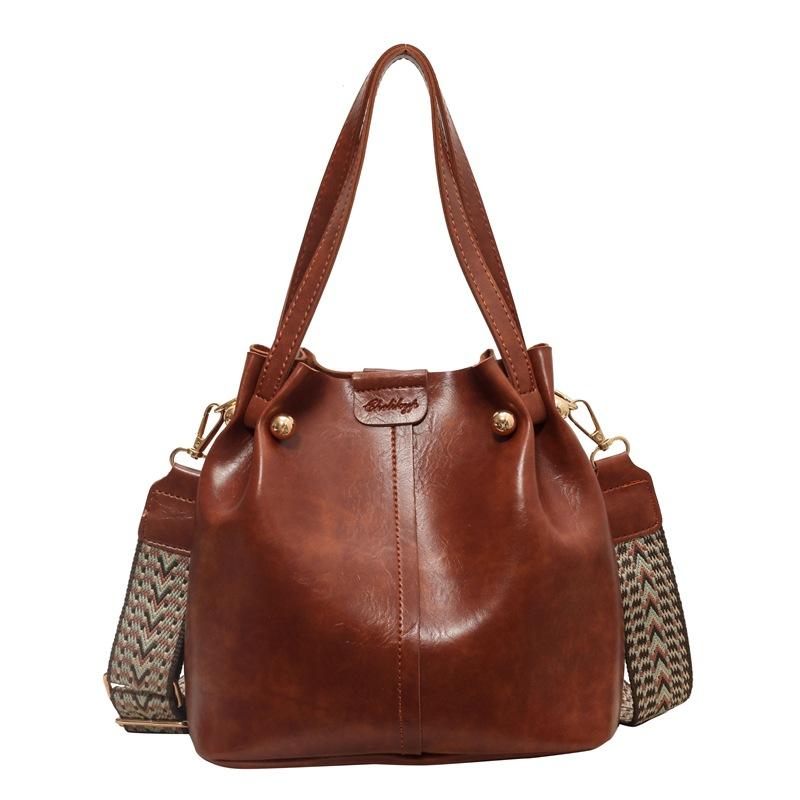 

Сегодняшние популярные сумки, сумки-ведра, новые ретро осенне-зимние широкие плечевые ремни, одноплечные портативные сумки-мессенджеры, модные хаки