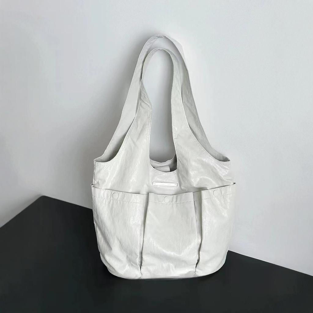 Korean niche design tote bag hand-held pleated underarm bag women's shoulder bag three pockets soft leather women's bag tide