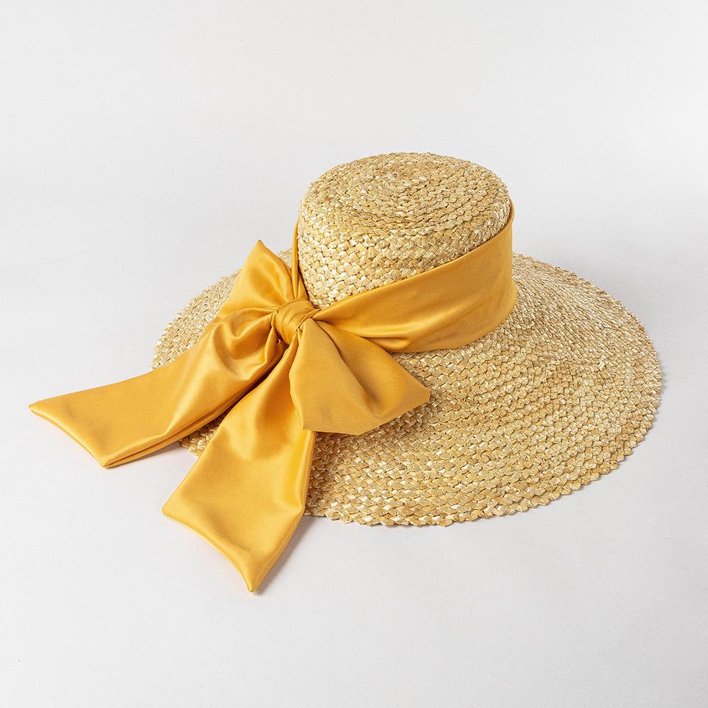 High-quality Hand-knitted Petal Wheat Straw Flat Top Large Eaves Basin Hat Women's Fashion Big Bow Beach Sun Shade Straw Hat