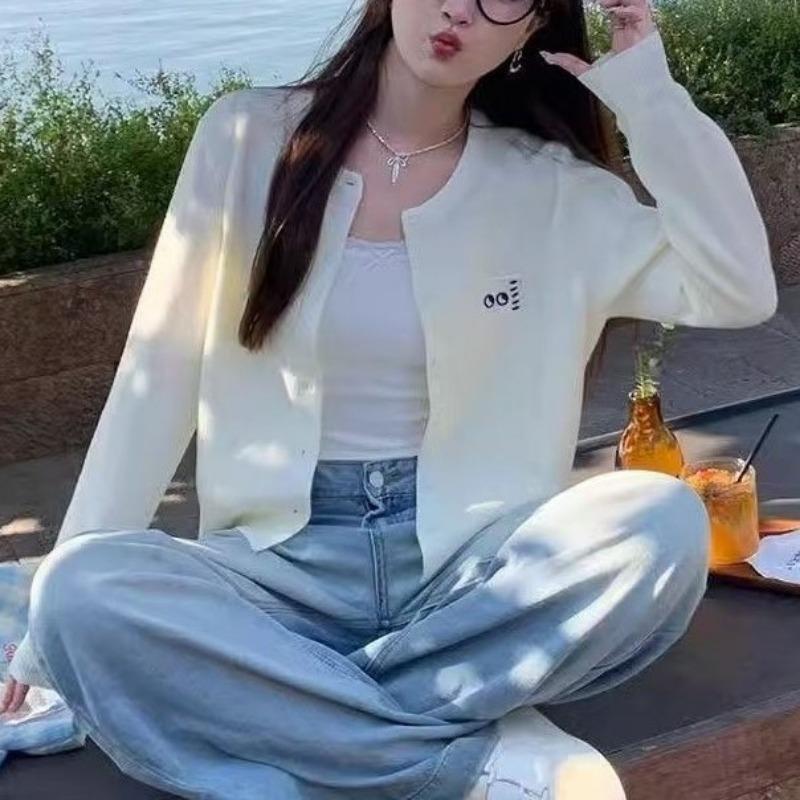 Simple knitted cardigan early autumn new women's clothing design sense long sleeve soft waxy versatile short top