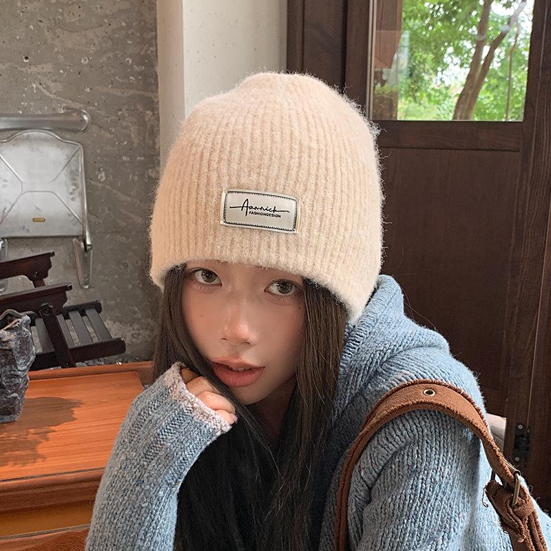 Simple cloth label wool wool hat women's autumn and winter comfortable cold hat outdoor cycling ear hat fashionable versatile knitted hat
