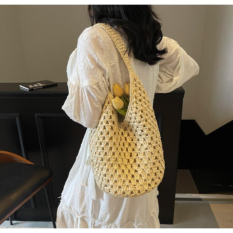Neue hohle Stroh-Tragetasche Damen Strandurlaubsstil Lässige Schulter-Strandtasche Große Kapazität Stroh gewebte Tragetasche