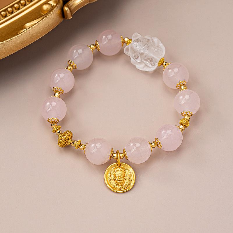 Light luxury powder crystal bracelet, original gold-plated flower vajra pestle pendant, premium temperament hand beaded bracelet.