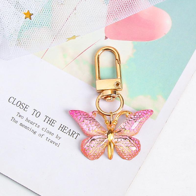 Gradient Butterfly Pendant: Iridescent Keychain Charm for Backpack or Earphone Case.