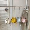 2026 New Drawstring Bucket Bag for Women Soft Leather Crossbody Bag with Ball Charm Mini Shoulder Handbag for Daily Shopping