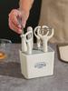 A 6-piece Kitchen Tool Fruit Slicer Set with Storage Holder, Melon Planer, Scissors, Bottle Opener, and Egg Beater Set