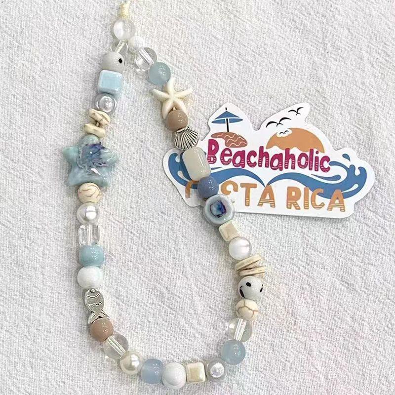 

Holiday party gifts for girls, family and friends, birthday gifts, light blue ceramic starfish hanging chains, bags, accessories синий