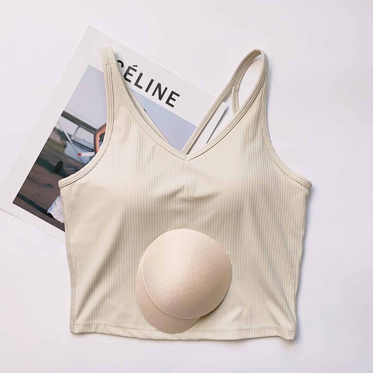 

Спортивный жилет Xi Yang Mu Xue с нагрудными вкладышами - Эластичный утягивающий топ без рукавов для йоги и фитнеса Extra Large слоновая кость/белый