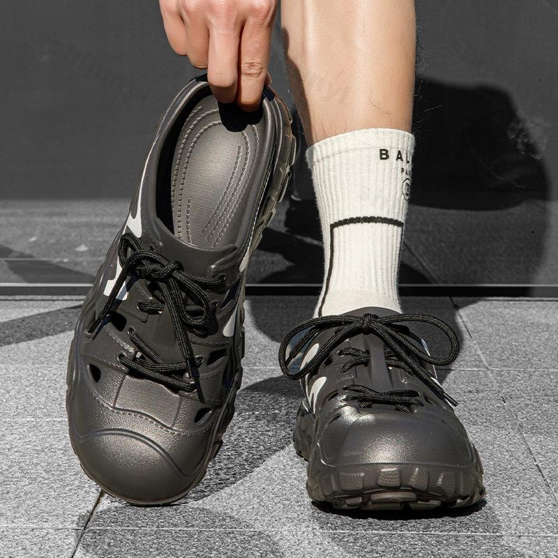 Moda Lato 2025 Nowy Styl Męskie Buty Jaskiniowe Puste Oddychające Kapcie Plażowe Outdoorowe Wygodne Lekkie Modne Casualowe Sandały