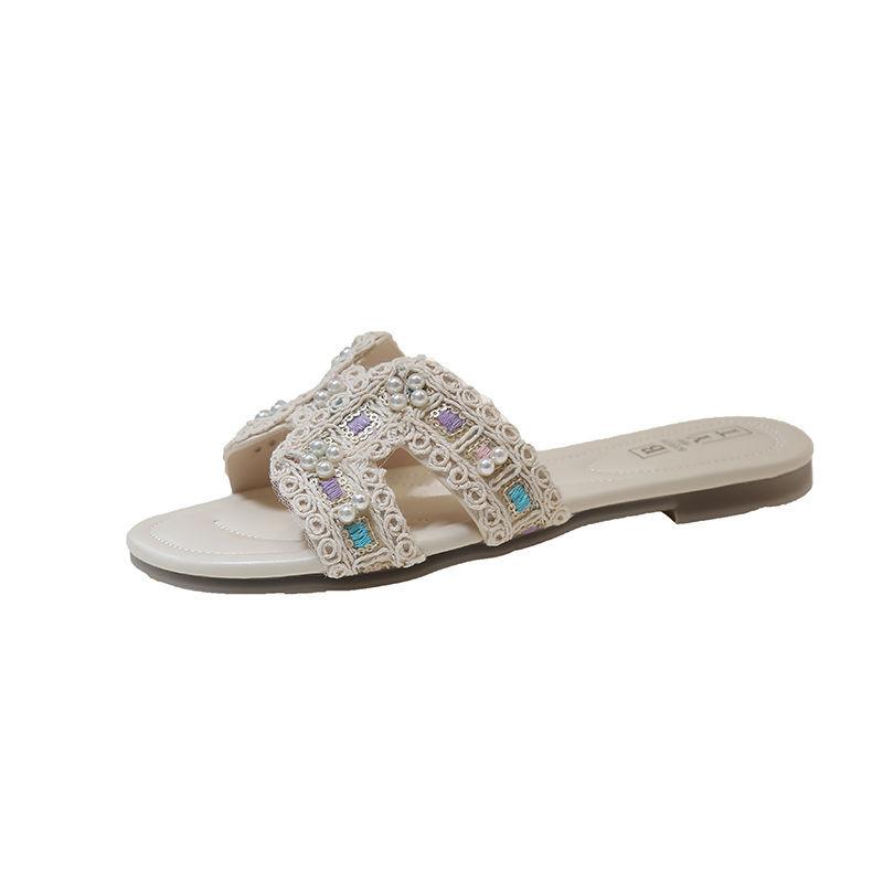 Flat bottom Internet celebrity cool slippers women wear 2025 new summer fairy wind pearl rhinestone word with beach slippers