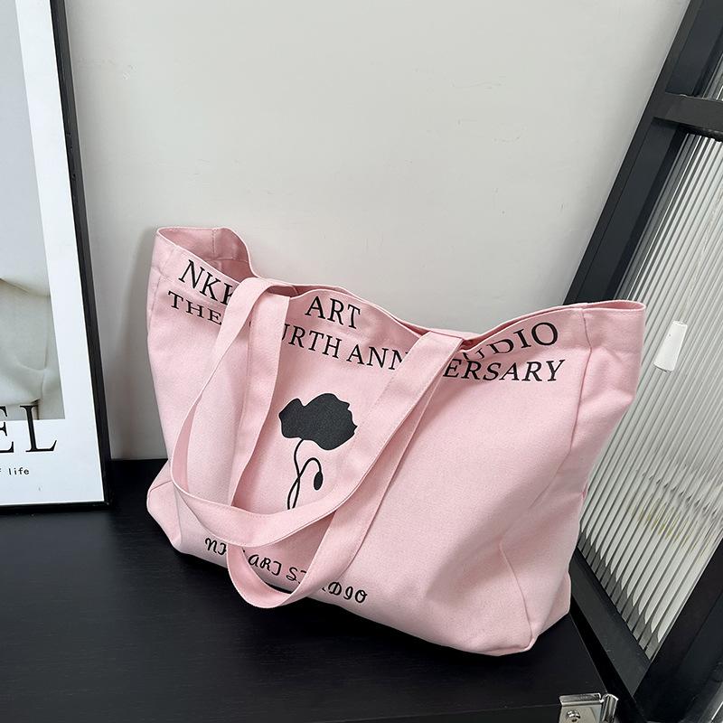 

2025 spring and summer new canvas large-capacity leisure bag foreign style going out make-up bag shoulder tote bag fashion Korean version розовый