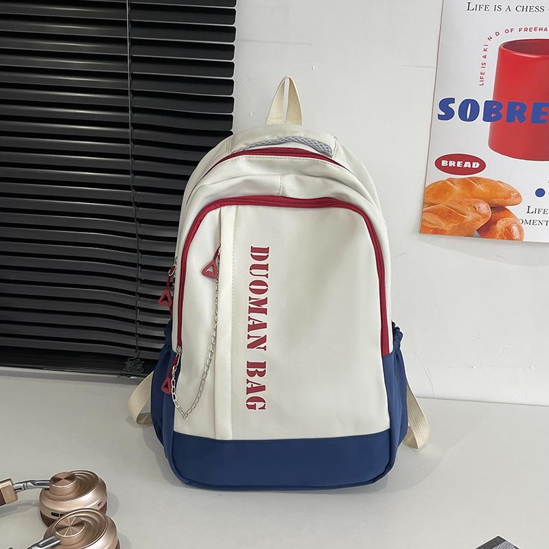 Schoolbag schoolbag 1011 summer new Korean version simple anti-theft contrasting color backpack junior high school college student shoulder back